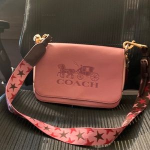 Coach crossbody backwheel of logo is peeling, gently used
